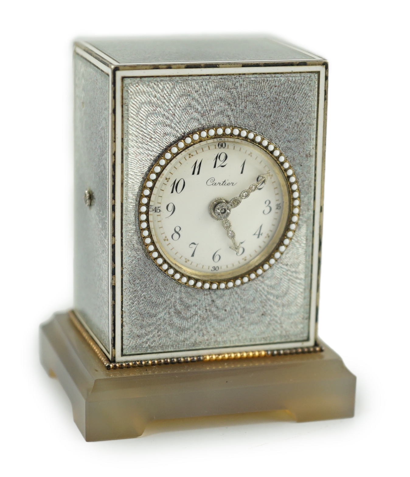 A fine Belle Époque Cartier silver, gold, diamond and guilloche enamel mounted 'Mignonette' timepiece, on an agate plinth base
